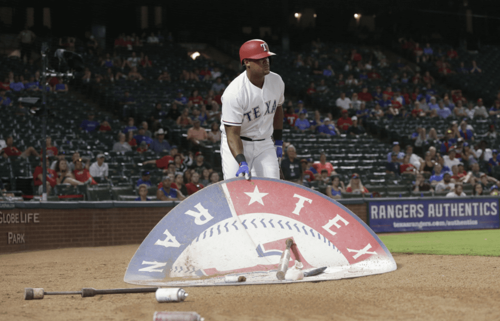 Jul 26, 2017; Arlington, TX, USA; Texas Rangers third baseman Adrian Beltre (29) moves the on deck circle in the eighth inning against the Miami Marlins at Globe Life Park in Arlington. Beltre was ejected from the game. Mandatory Credit: Tim Heitman-Imagn Images