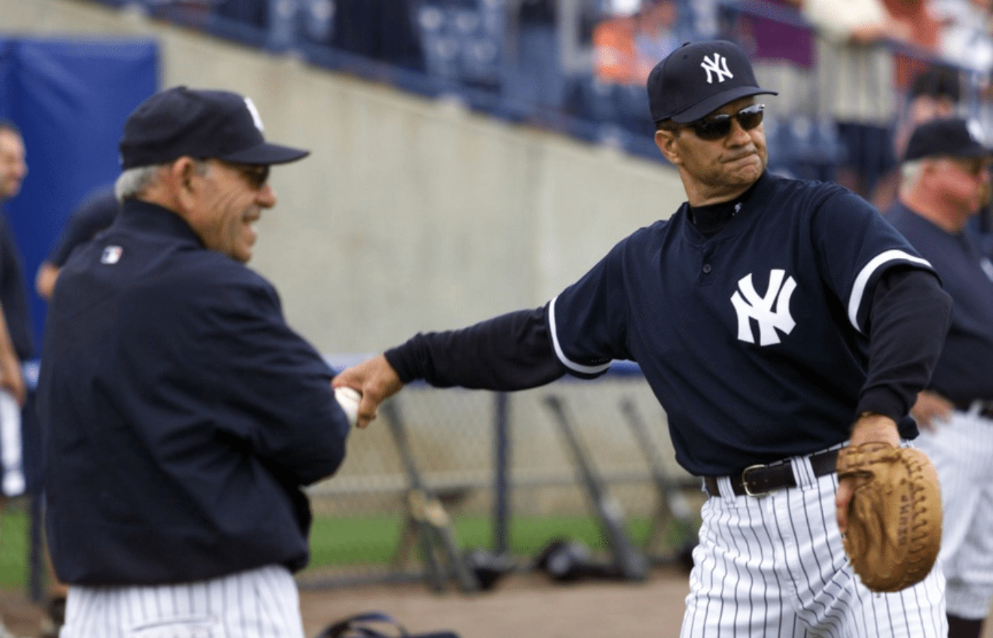 February 21, 2002; Tampa, FL, USA; Yankees spring training. Catching instructor Yogi Berra watches manager Joe Torre toss with a catchers mitt while warming up early in practice. Mandatory Credit: Chris Pedota/The Record via USA TODAY NETWORK