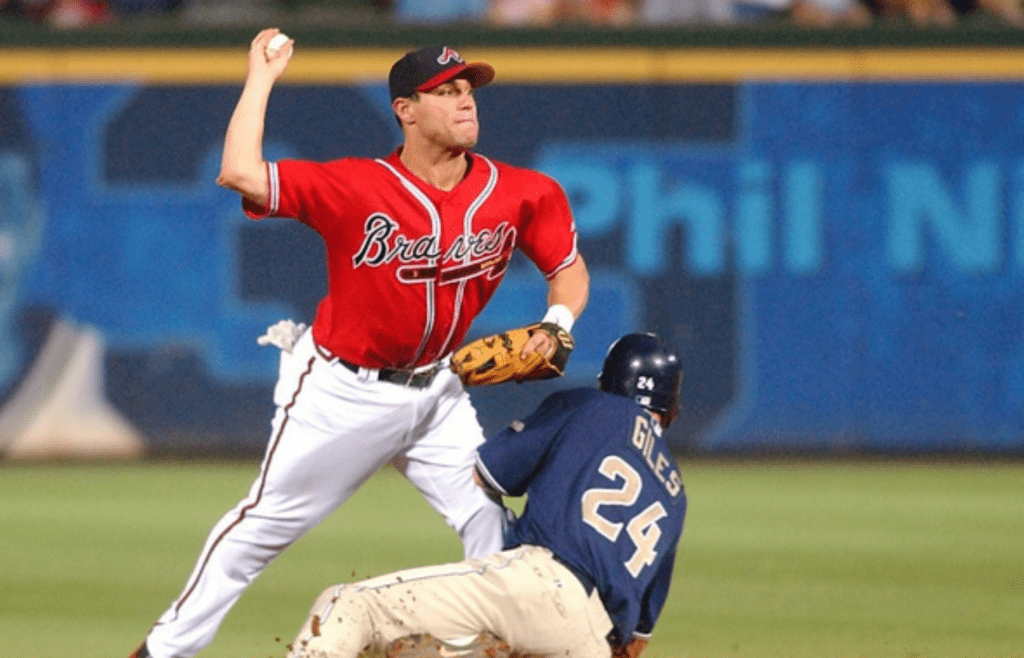 August 21, 2005: Atlanta, Georgia, USA: Atlanta Braves second baseman Marcus Giles turns the double play over Brian Giles in the sixth inning against the San Diego Padres at Turner Field. Mandatory Credit: Photo By Christopher Gooley-Imagn Images Copyright (c) 2005 Christopher Gooley