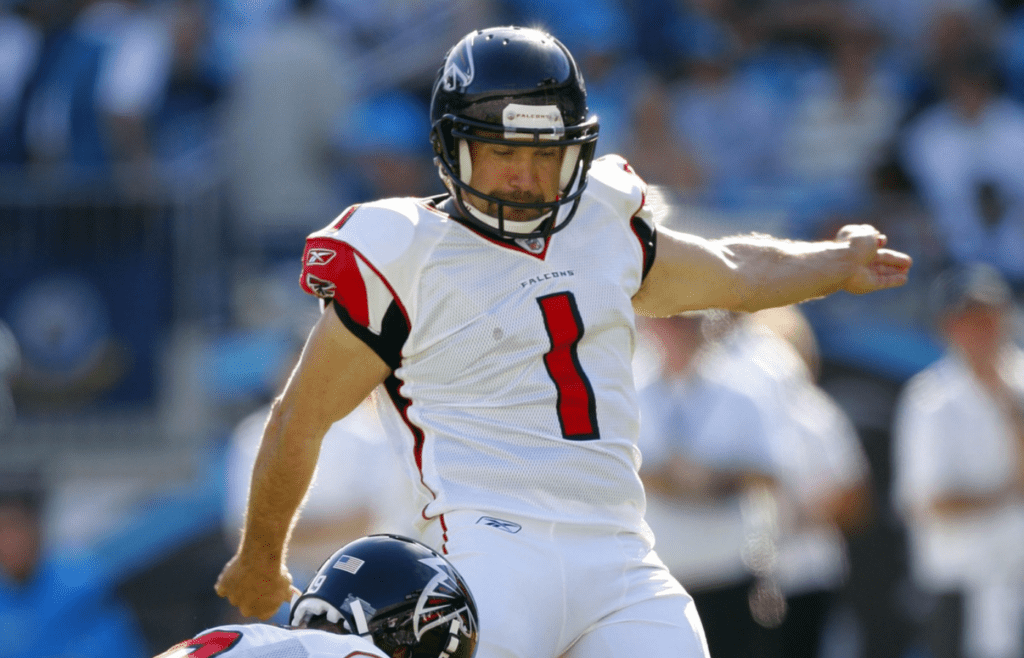 Atlanta Falcons punter Michael Koenen (9) holds the ball as kicker Jason Elam (1) kicks at Bank of America Stadium. The Carolina Panthers defeated the Falcons 28-19.