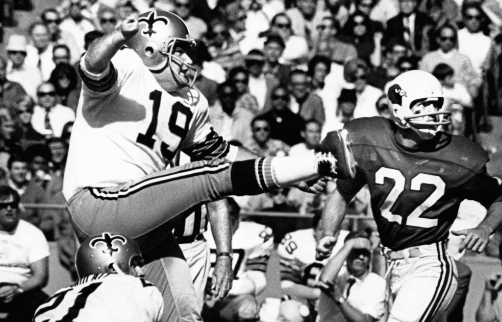 New Orelans Saints kicker Tom Dempsey (19) kicks a field goal against the St. Louis Cardinals at Busch Stadium.