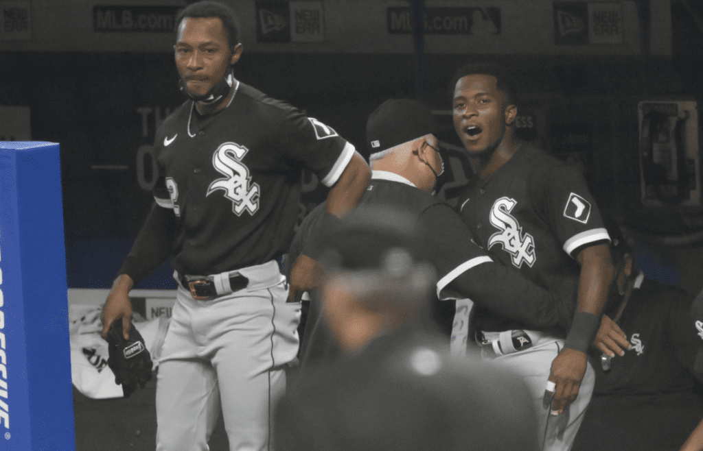 Sep 22, 2020; Cleveland, Ohio, USA; Chicago White Sox manager Rick Renteria, center, holds back shortstop Tim Anderson (7) in the dugout in the tenth inning against the Cleveland Indians at Progressive Field. Both Renteria and Anderson were ejected from the game. Mandatory Credit: David Richard-Imagn Images