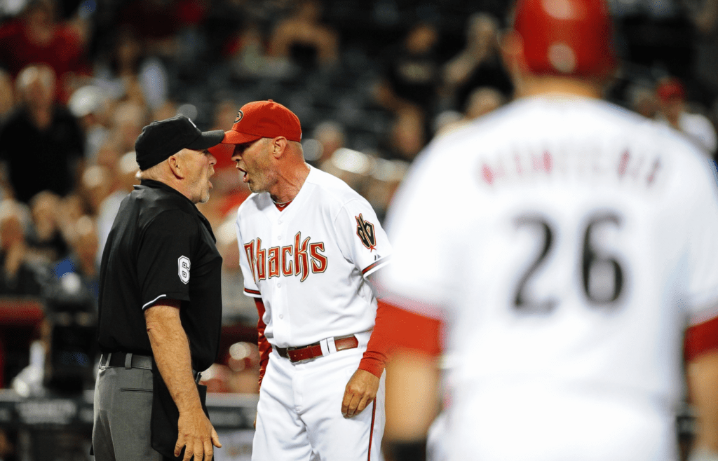 Apr. 12, 2011; Phoenix, AZ, USA; Arizona Diamondbacks manager Kirk Gibson argues with home plate umpire Bob Davidson after being ejected in the third inning against the St. Louis Cardinals at Chase Field. Mandatory Credit: Mark J. Rebilas-Imagn Images