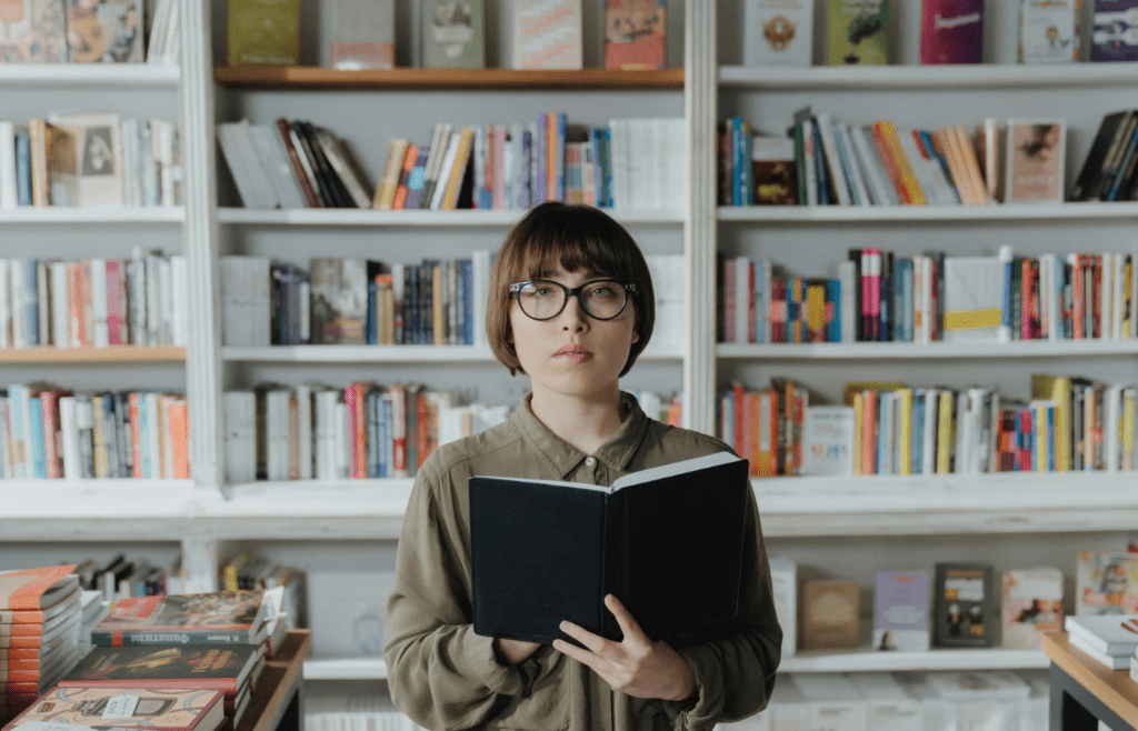 A person reading a philosophy book in a library