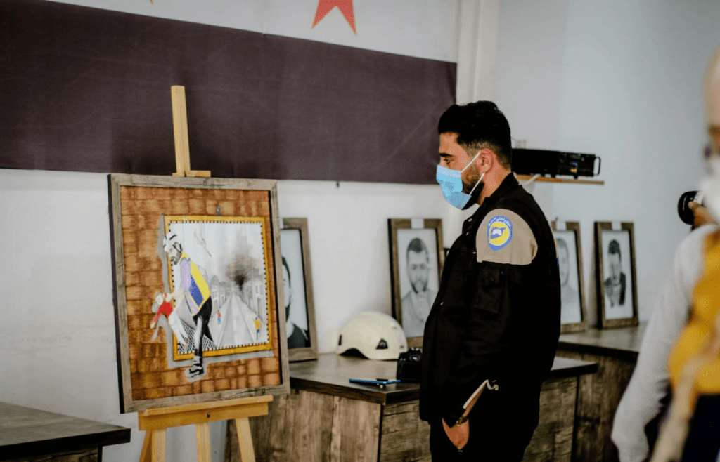 A student observing artwork in a museum