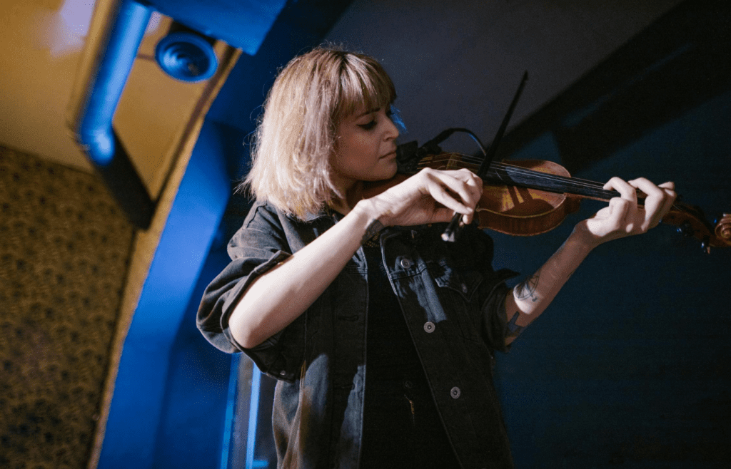 A musician practicing with an instrument