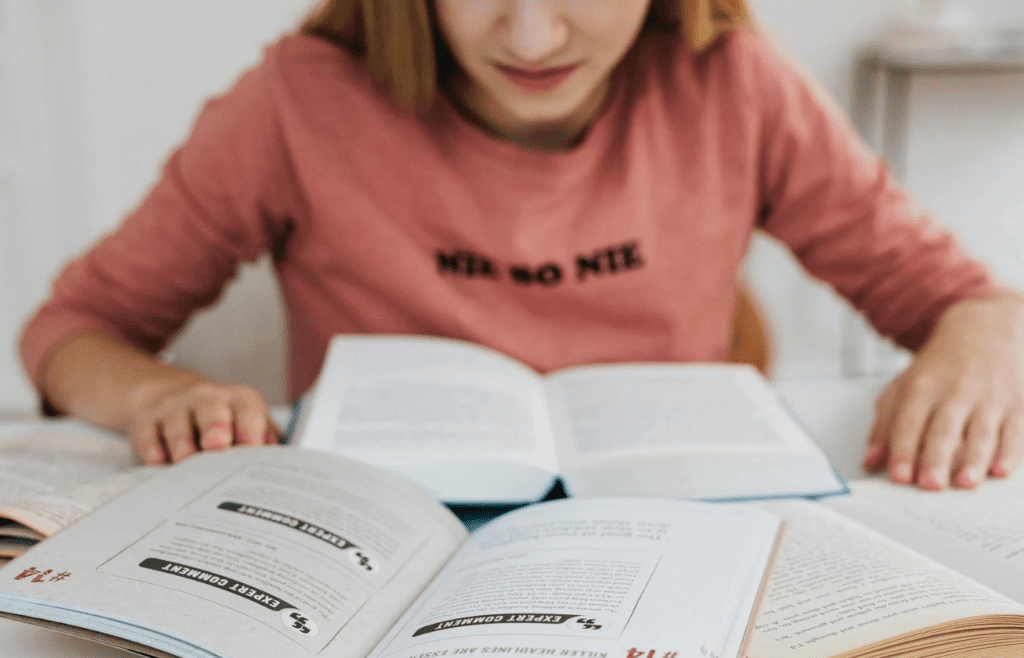 A student studying multiple language books