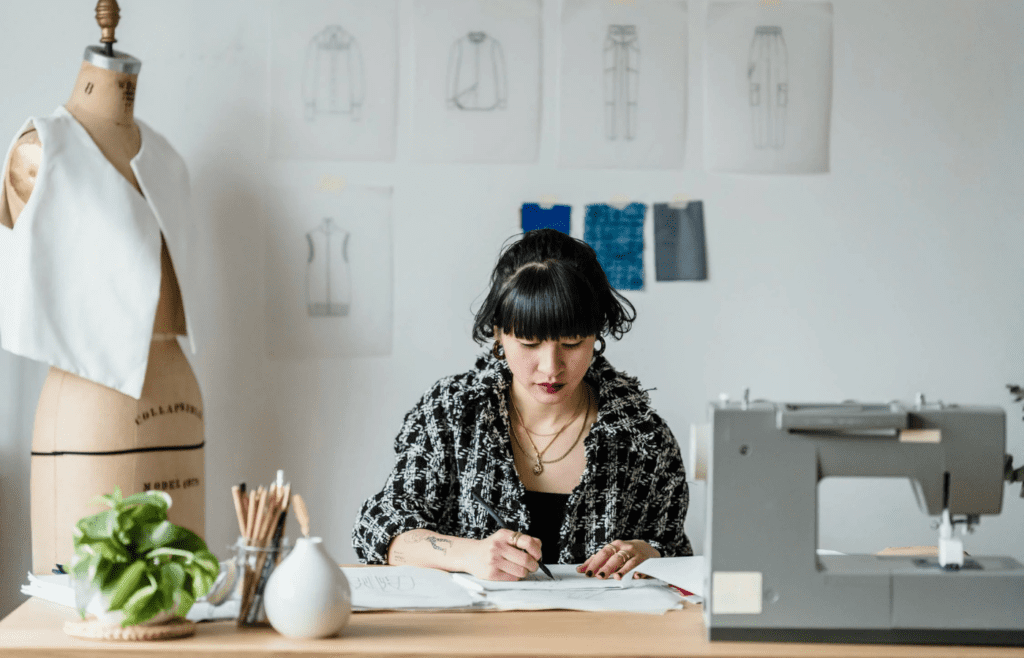 A fashion designer sketching new clothing designs