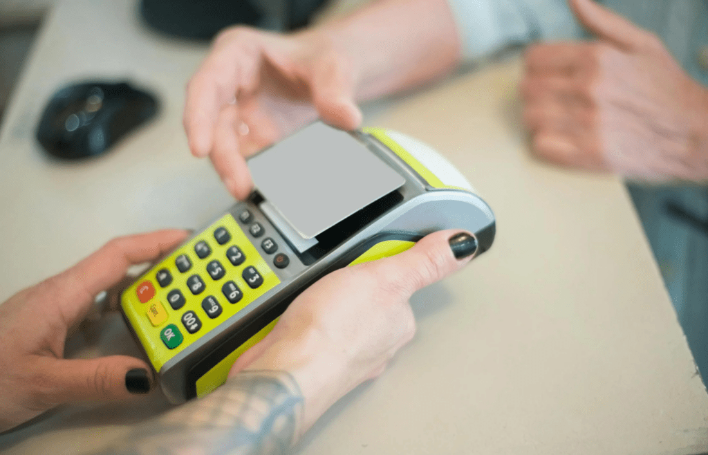 A shopper scanning a loyalty card