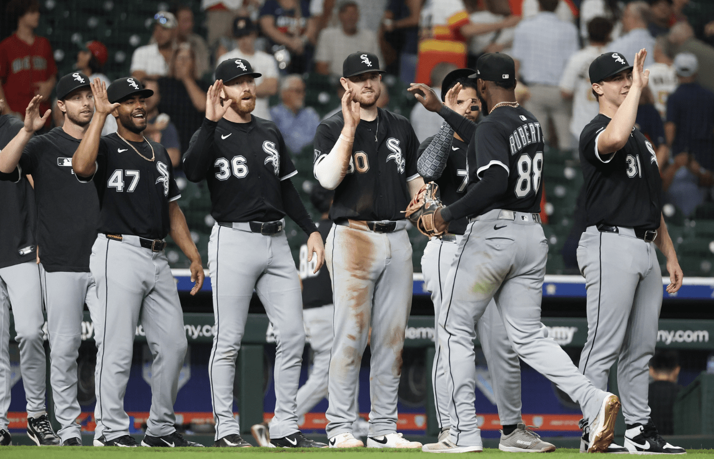 Jun 10, 2025; Houston, Texas, USA; Chicago White Sox center fielder Luis Robert Jr. (88) celebrates with his team after defeating the Houston Astros at Daikin Park. Mandatory Credit: Thomas Shea-Imagn Images