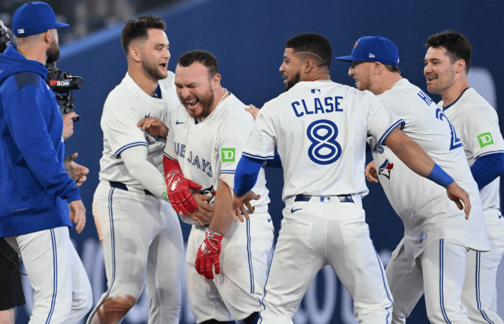 Jun 4, 2025; Toronto, Ontario, CAN; Toronto Blue Jays catcher Alejandro Kirk (30) celebrates with team mates after hitting a walkoff RBI double against the Philadelphia Phillies in the ninth inning at Rogers Centre. Mandatory Credit: Dan Hamilton-Imagn Images