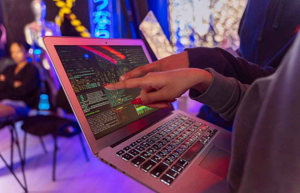 A person following instructions on a computer screen