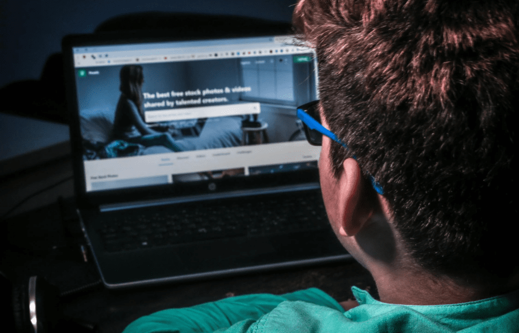 A person exploring various websites on a laptop