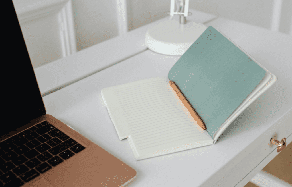 Lined notebooks and pens on a desk