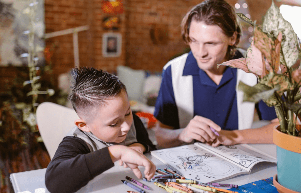 Kids playing with coloring books and crayons