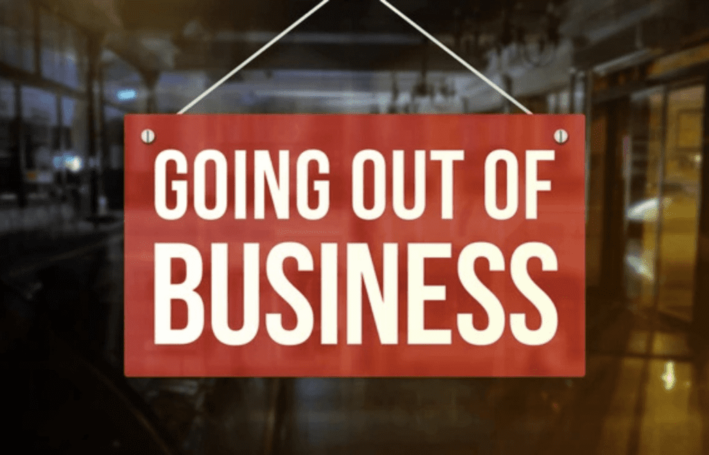 A vacant bookstore with “Going Out of Business” signs