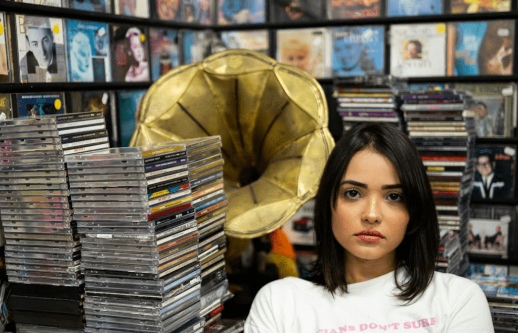 Music CDs on display with Blockbuster branding
