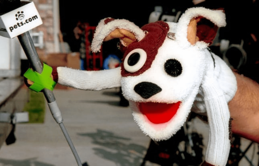 A sock puppet mascot and delivery box