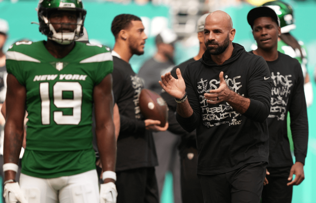 New York Jets head coach Robert Saleh claps his hands as he greets his team during warm-ups before the game against the Miami Dolphins at Hard Rock Stadium in Miami Gardens, Dec. 17, 2023.