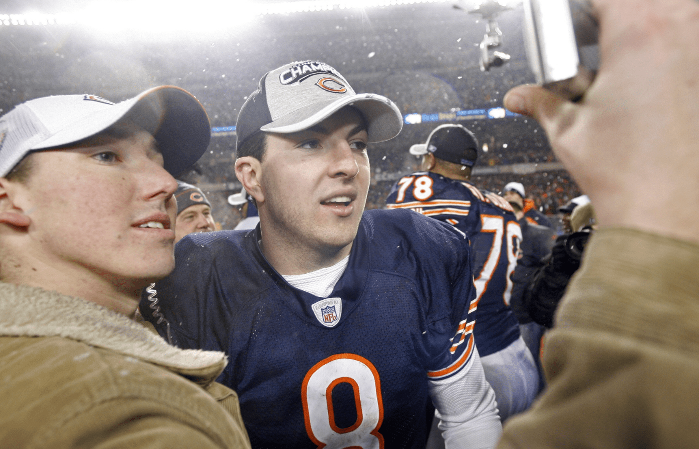 Jan 21, 2007; Chicago, IL, USA; Chicago Bears quarterback (8) Rex Grossman takes pictures on the field after his team defeated the New Orleans Saints 39-14 to win the NFC Championship game at Soldier Field in Chicago, IL. Mandatory Credit: Jerry Lai-Imagn Images Copyright © 2007 Jerry Lai