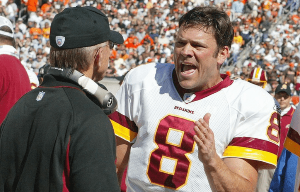 Oct 3, 2004; Cleveland, OH, USA;Washington Redskins #8 Mark Brunell talks with head coach Joe Gibbs on the sidelines at Cleveland Browns Stadium. The Browns beat the Redskins 17-13. Mandatory Credit: Photo by Matthew Emmons-Imagn Images (©) Copyright 2004 by Matthew Emmons