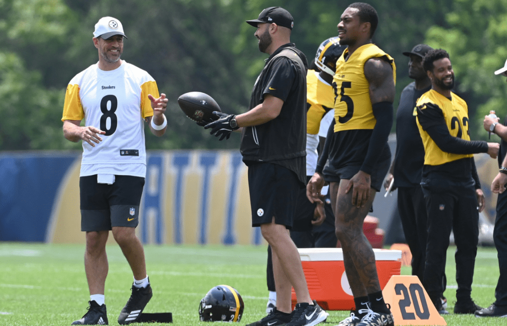 Jun 10, 2025; Pittsburgh, PA, USA; Pittsburgh Steelers quarterback Aaron Rodgers (8) gets the ball during minicamp at their South Side facility. Mandatory Credit: Philip G. Pavely-Imagn Images