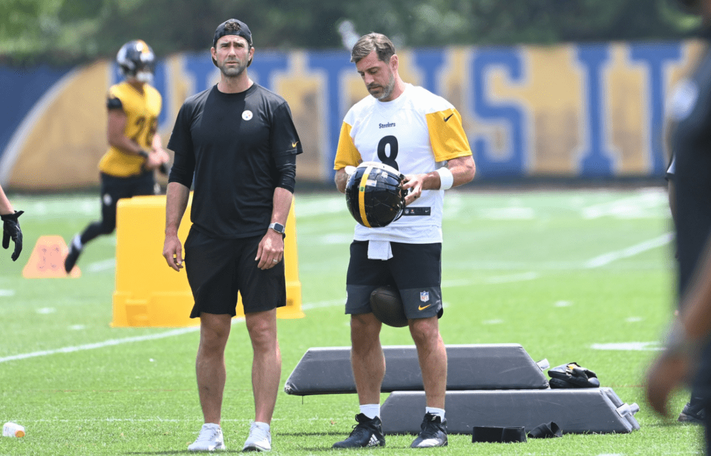 Jun 10, 2025; Pittsburgh, PA, USA; Pittsburgh Steelers quarterback Aaron Rodgers (8) puts on his helmet during minicamp at their South Side facility. Mandatory Credit: Philip G. Pavely-Imagn Images