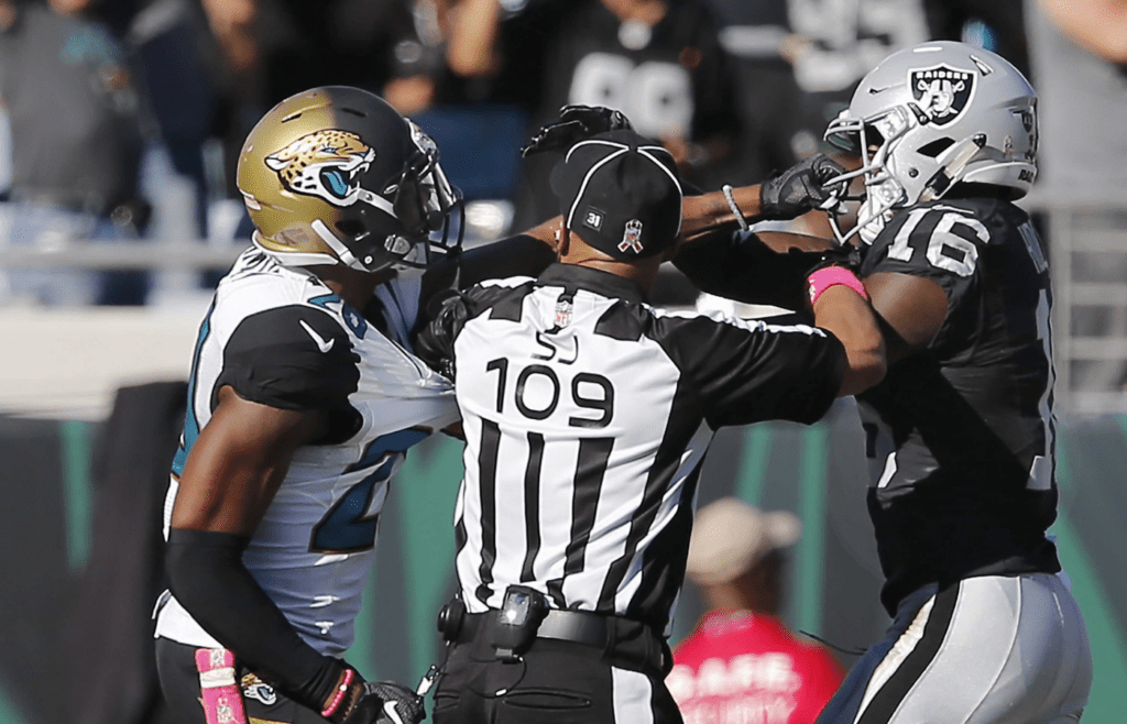 Oct 23, 2016; Jacksonville, FL, USA; Oakland Raiders wide receiver Johnny Holton (16) and Jacksonville Jaguars cornerback Jalen Ramsey (20) are separated by side judge Dyrol Prioleau (109) after a fight during the second half of a football game at EverBank Field. The Raiders won 33-16. Mandatory Credit: Reinhold Matay-Imagn Images