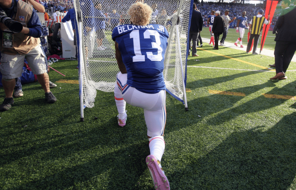 Oct 16, 2016; East Rutherford, NJ, USA; New York Giants wide receiver Odell Beckham Jr. (13) gets on one knee and proposes to the kicking net after scoring a touchdown against the Baltimore Ravens during the fourth quarter at MetLife Stadium. Mandatory Credit: Brad Penner-Imagn Images