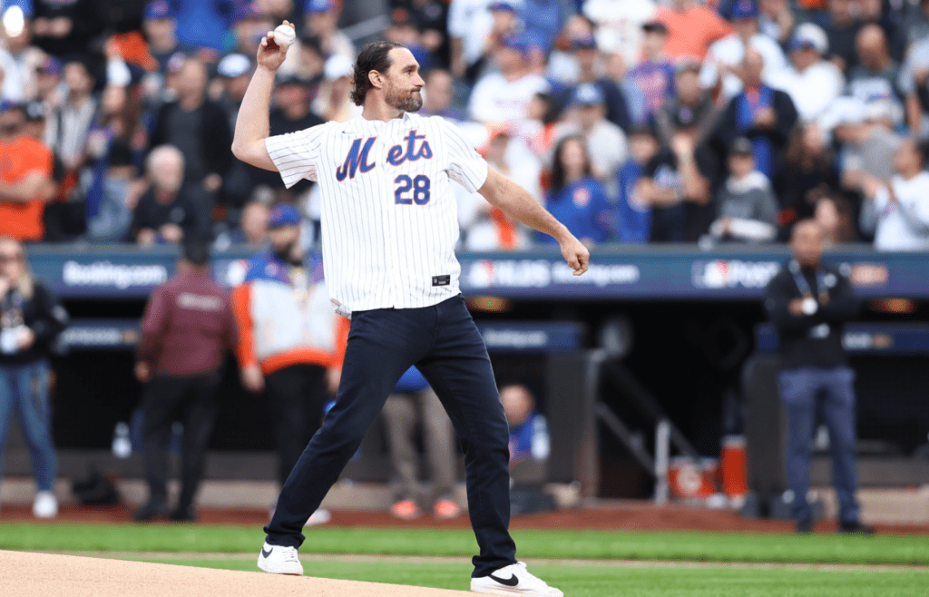 Oct 9, 2024; New York, New York, USA; New York Mets former infielder Daniel Murphy throws out the ceremonial first pitch before game four of the NLDS for the 2024 MLB Playoffs against the Philadelphia Phillies at Citi Field. Mandatory Credit: Wendell Cruz-Imagn Images