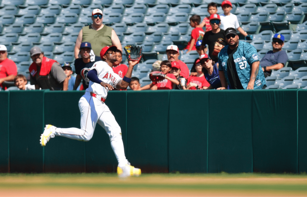 Jun 11, 2025; Anaheim, California, USA; Los Angeles Angels right fielder Jorge Soler (12) catches the fly ball of Athletics shortstop Max Schuemann (12) during the eighth inning at Angel Stadium. Mandatory Credit: Gary A. Vasquez-Imagn Images
