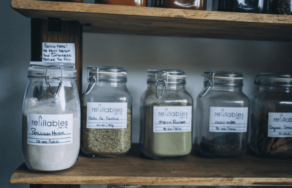 A shelf of brightly labeled spice jars