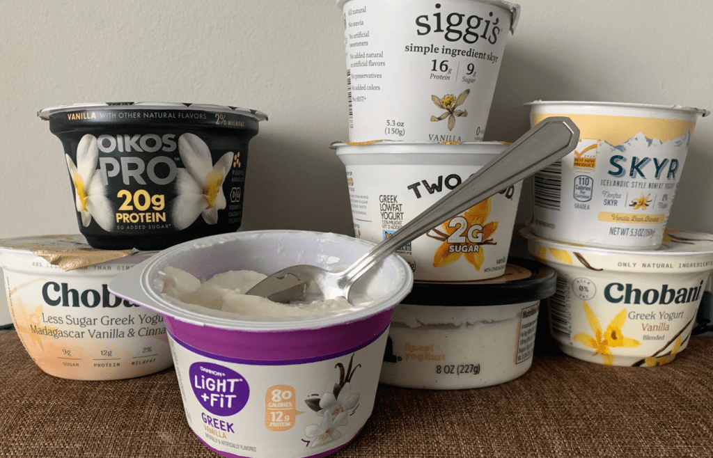 Individual yogurt cups in a dairy case