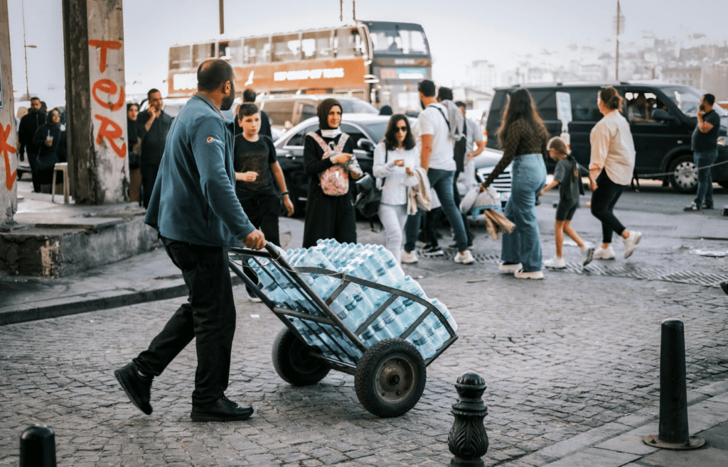A shopping cart loaded with bottled water