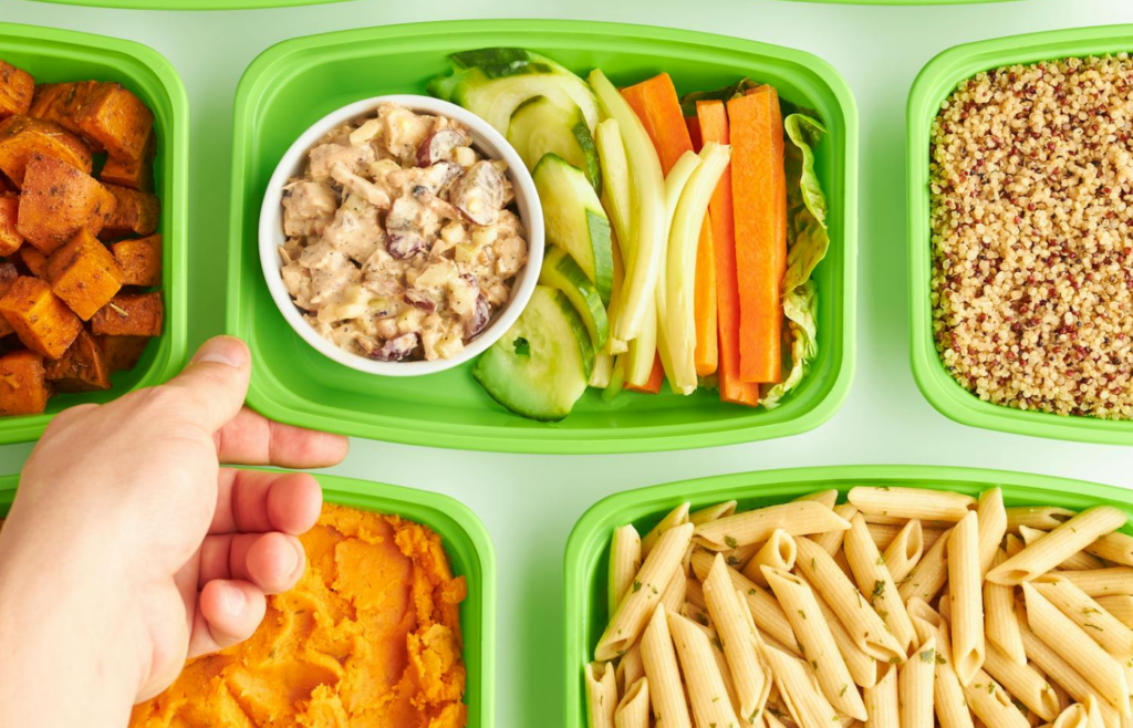 Plastic containers of pasta and potato salad at the deli counter