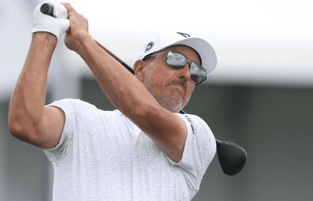 Jun 10, 2025; Oakmont, Pennsylvania, USA; Phil Mickelson hits from the tenth tee box during a practice round for the U.S. Open golf tournament at Oakmont Country Club. Mandatory Credit: Charles LeClaire-Imagn Images
