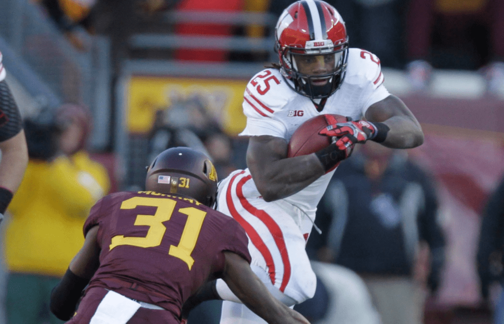 Wisconsin Badgers running back Melvin Gordon (25) picks up 18 yards in the first quarter before being tackled by Minnesota defensive back Eric Murray (31) during the Big 10 football game at TCF Bank Stadium in Minneapolis, Minnesota, Saturday, Nov. 23, 2013