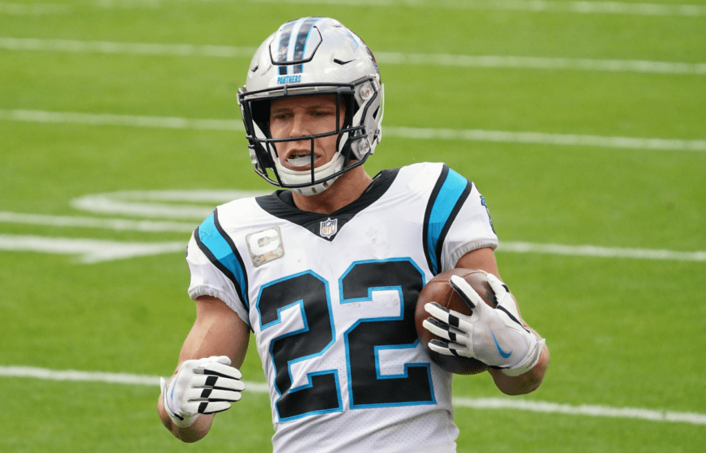 Nov 8, 2020; Kansas City, Missouri, USA; Carolina Panthers running back Christian McCaffrey (22) scores a touchdown during the game against the Kansas City Chiefs at Arrowhead Stadium. Mandatory Credit: Denny Medley-Imagn Images