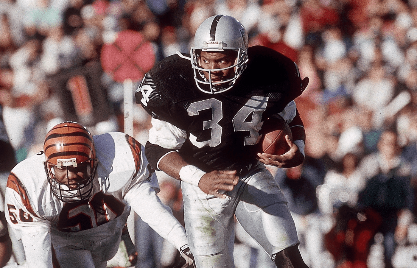 Dec 16, 1990; Los Angeles, CA, USA; FILE PHOTO; Los Angeles Raiders running back Bo Jackson (34) in action against Cincinnati Bengals linebacker James Francis (50) at Los Angeles Memorial Coliseum. Mandatory Credit: Peter Brouillet-USA TODAY NETWORK