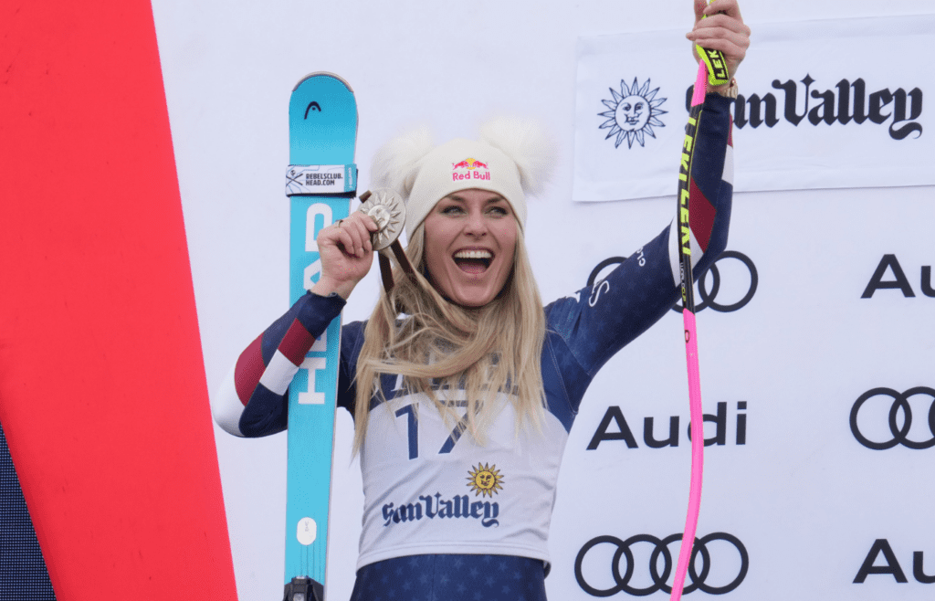 Mar 23, 2025; Sun Valley, ID, USA; Lindsey Vonn of the United States celebrates on the podium after placing second in the Super G alpine skiing race in the 2025 FIS Ski World Cup at Sun Valley. Mandatory Credit: Michael Madrid-Imagn Images