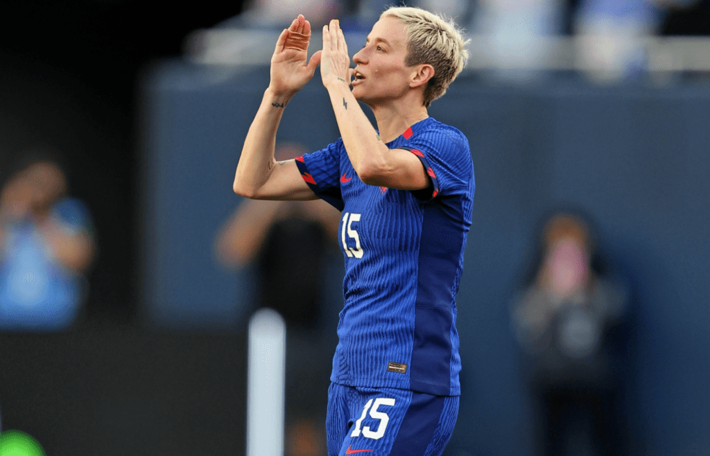 Sep 24, 2023; Chicago, Illinois, USA; United States forward Megan Rapinoe (15) acknowledges fans as she is substituted off in her final appearance on the national team during the second half against South Africa at Soldier Field. Mandatory Credit: Jon Durr-Imagn Images