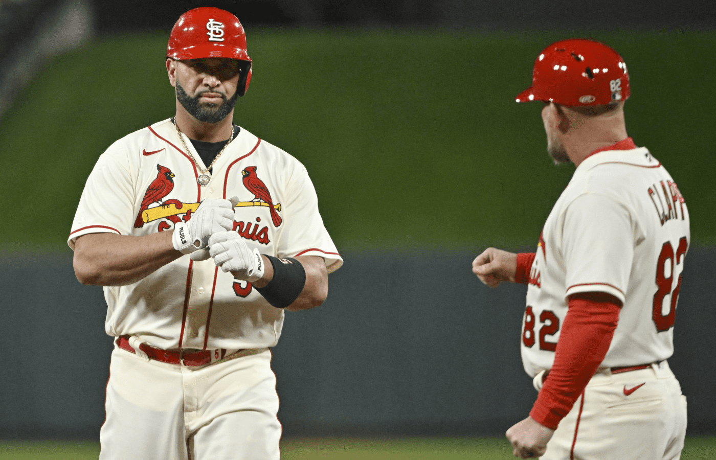 Oct 8, 2022; St. Louis, Missouri, USA; St. Louis Cardinals designated hitter Albert Pujols (5) reacts after his single in the sixth inning against the Philadelphia Phillies during game two of the Wild Card series for the 2022 MLB Playoffs at Busch Stadium. Mandatory Credit: Jeff Curry-Imagn Images