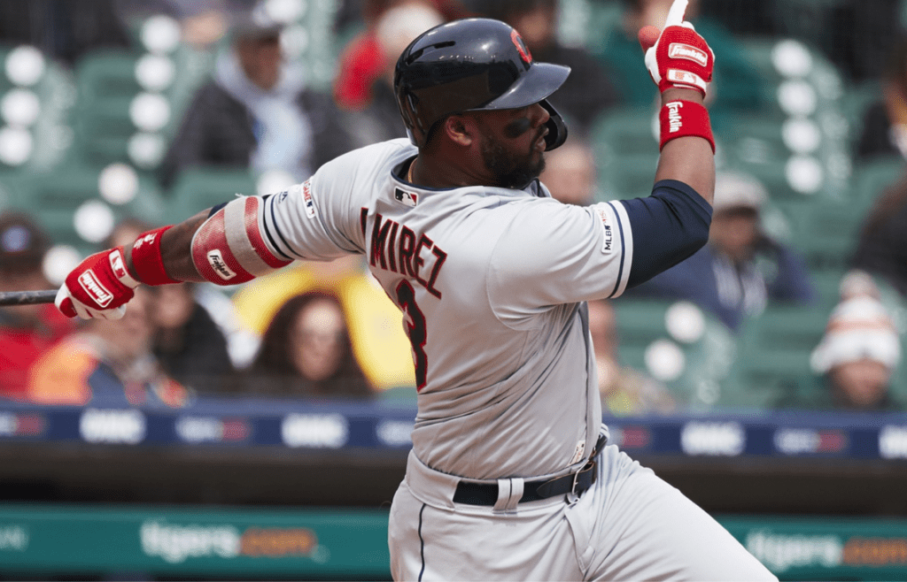 Apr 10, 2019; Detroit, MI, USA; Cleveland Indians shortstop Hanley Ramirez (13) hits an RBI double in the sixth inning against the Detroit Tigers at Comerica Park. Mandatory Credit: Rick Osentoski-Imagn Images