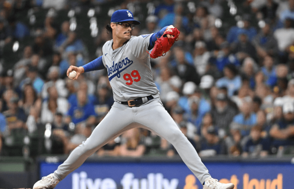 Los Angeles Dodgers pitching coach Mark Prior (99) delivers a pitch against the Milwaukee Brewers in the sixth inning at American Family Field.
