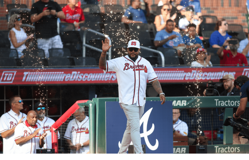 Jul 22, 2024; Atlanta, Georgia, USA; Former Atlanta Braves center fielder Andruw Jones is honored before a game against the Cincinnati Reds at Truist Park. Mandatory Credit: Brett Davis-Imagn Images