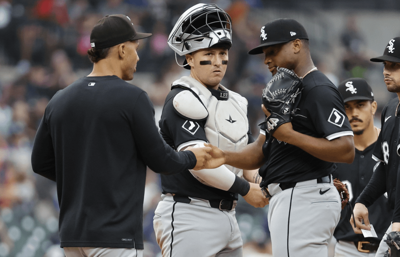 Chicago White Sox interim manager Grady Sizemore (24) take the ball to relieve relief pitcher Prelander Berroa (66) pitches in the eighth inning against the Detroit Tigers at Comerica Park.