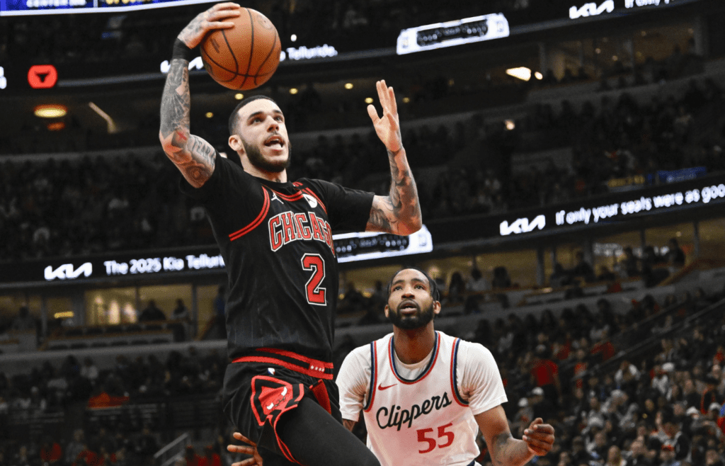 Feb 26, 2025; Chicago, Illinois, USA; Chicago Bulls guard Lonzo Ball (2) shoots against LA Clippers forward Derrick Jones Jr. (55) during the second half at the United Center. Mandatory Credit: Matt Marton-Imagn Images