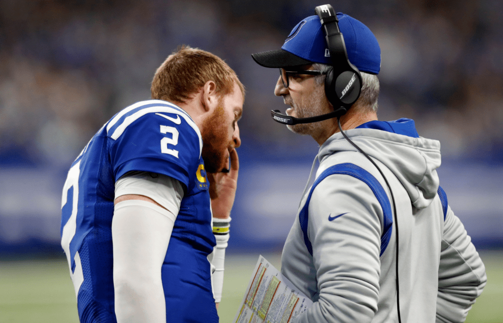 Indianapolis Colts head coach Frank Reich talks with Indianapolis Colts quarterback Carson Wentz (2) on Sunday, Jan. 2, 2022, during a game against the Las Vegas Raiders at Lucas Oil Stadium in Indianapolis.