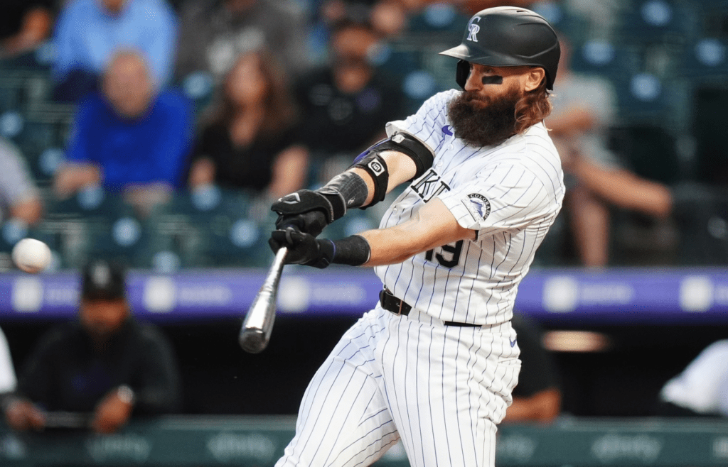 Sep 25, 2024; Denver, Colorado, USA; Colorado Rockies outfielder Charlie Blackmon (19) singles in the first inning against the St. Louis Cardinals at Coors Field. Mandatory Credit: Ron Chenoy-Imagn Images