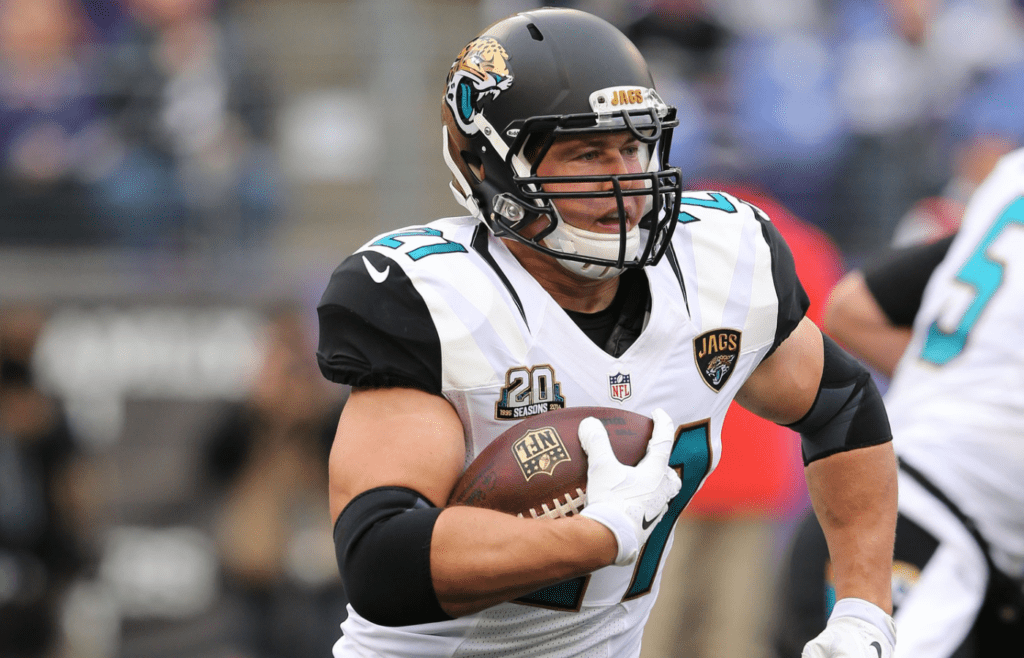 Dec 14, 2014; Baltimore, MD, USA; Jacksonville Jaguars running back Toby Gerhart (21) runs the ball against the Baltimore Ravens at M&T Bank Stadium. Mandatory Credit: Mitch Stringer-Imagn Images